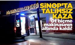 Ot biçme makinesinin altında kaldı