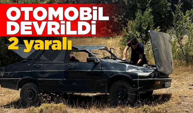 Devrilen otomobildeki 2 kişi yaralandı