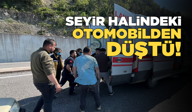 Seyir halindeki otomobilden düşerek yaralandı